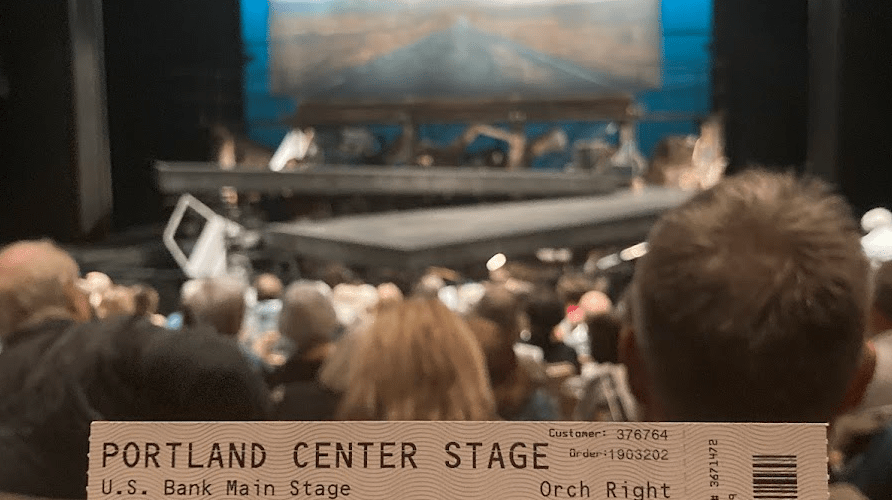 Ticket held in front of the stage for Portland Center Stage's "The Brothers Size"